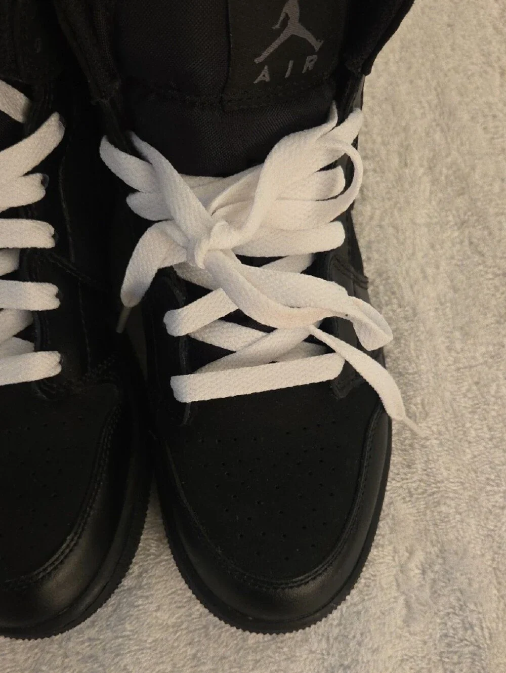 Jordan Kids Black and White High-Top Sneakers